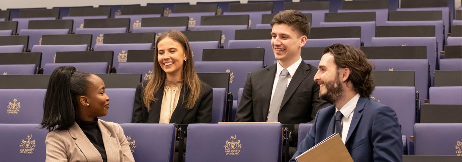 Group of students sitting in a lecture theatre