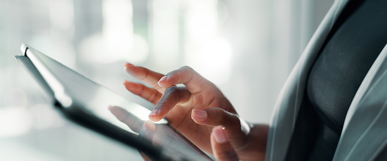 A person reading a website on a tablet computer