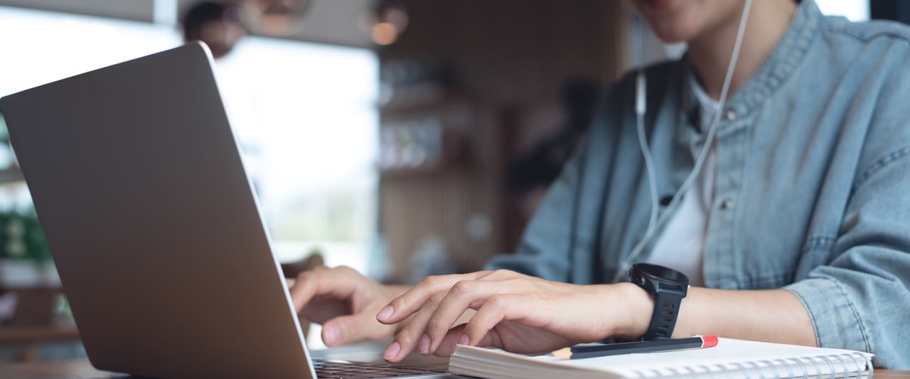 A person working with a laptop